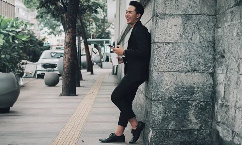 Man-in-black-suit-against-the-wall