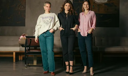 3-women-standing,-posing-at-the-camera