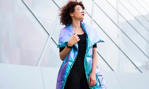 Women-wearing-mixed-color-jacket-over-black-dress