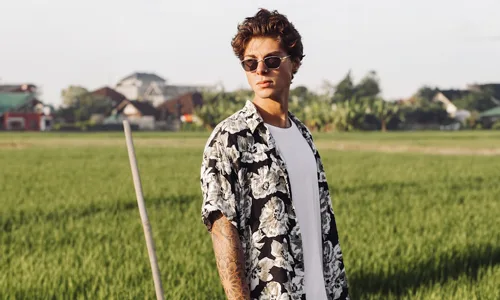 man in floral shirt and sunglasses