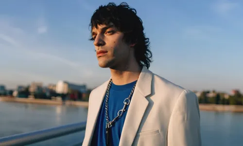 man wearing bold silver chain