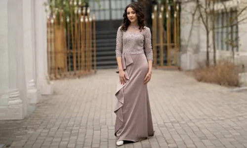 Girl in shiny party dress posing outdoors