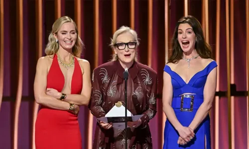 Three excited women standing infront of the mike