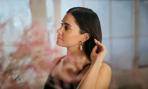 Women wearing pearl drop earring