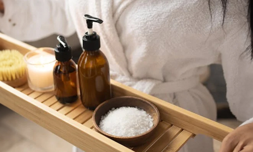 Women-in-bathrobe-with-spa-things-in-hand