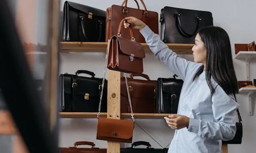 Woman-selecting-handbag