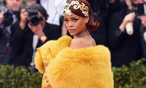 Rihanna in yellow dress
